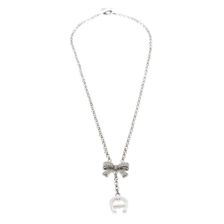 Pre Owned Aigner Crystal Studded Bow Silver Tone Long Toggle Necklace 