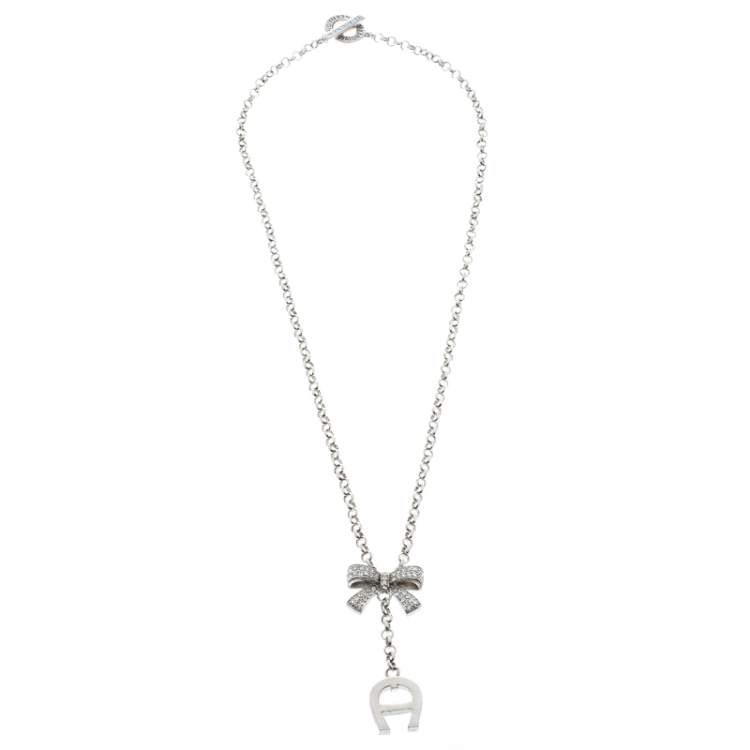 Pre Owned Aigner Crystal Studded Bow Silver Tone Long Toggle Necklace 