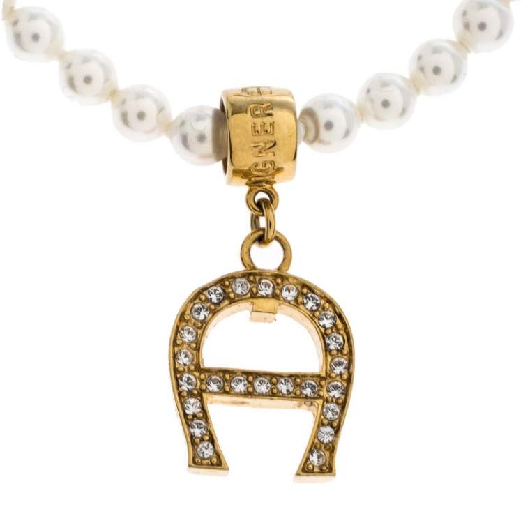 Pre Owned Aigner Faux Pearl Crystal Logo Pendant Magnetic Bracelet