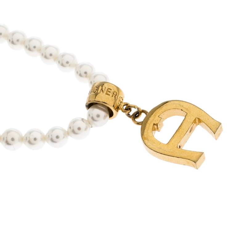 Pre Owned Aigner Faux Pearl Crystal Logo Pendant Magnetic Bracelet