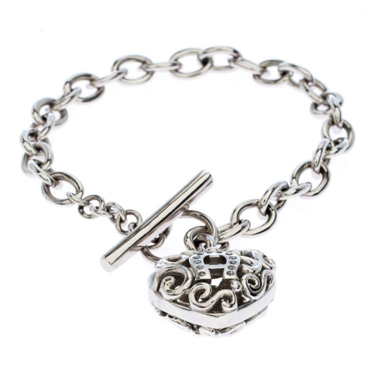Pre Owned Aigner Silver Plated Crystal Cutwork Heart Charm Toggle Bracelet