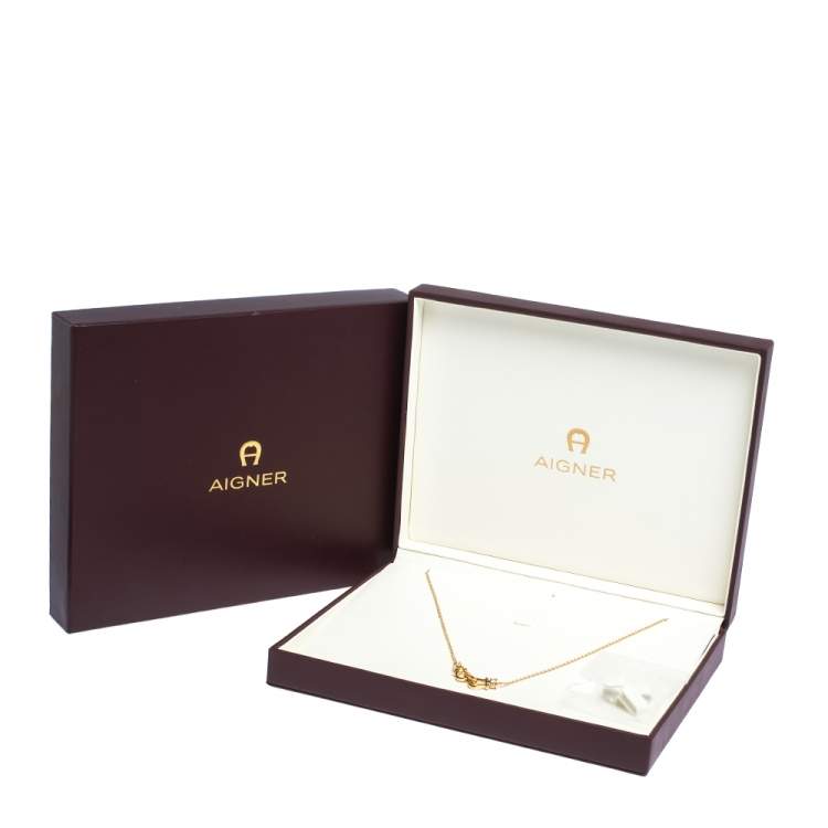 Pre Owned Aigner Crystal Embellished Horse Shoe Gold Tone Necklace