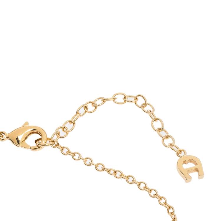 Pre Owned Aigner Crystal Embellished Horse Shoe Gold Tone Necklace