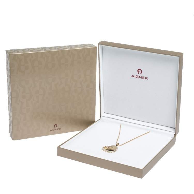 Pre Owned Aigner Logo Crystal Heart Motif Gold Tone Pendant Necklace
