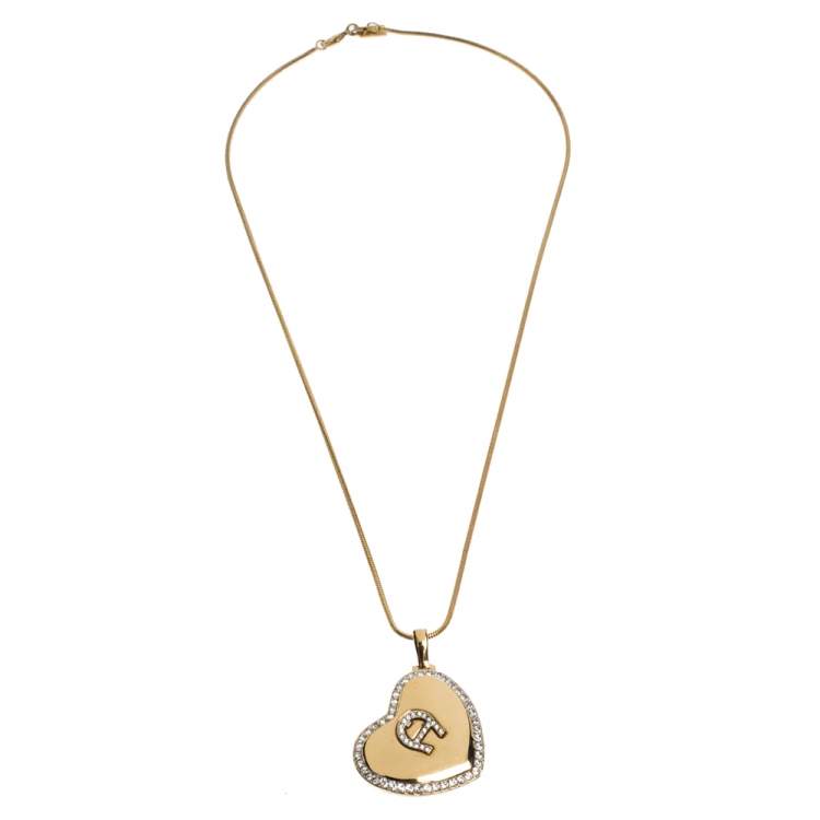 Pre Owned Aigner Logo Crystal Heart Motif Gold Tone Pendant Necklace