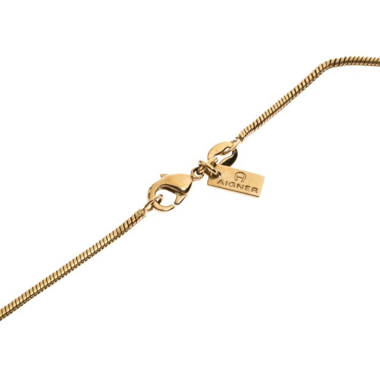 Pre Owned Aigner Logo Crystal Heart Motif Gold Tone Pendant Necklace