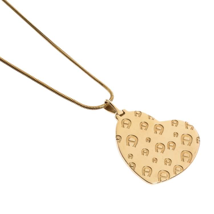 Pre Owned Aigner Logo Crystal Heart Motif Gold Tone Pendant Necklace