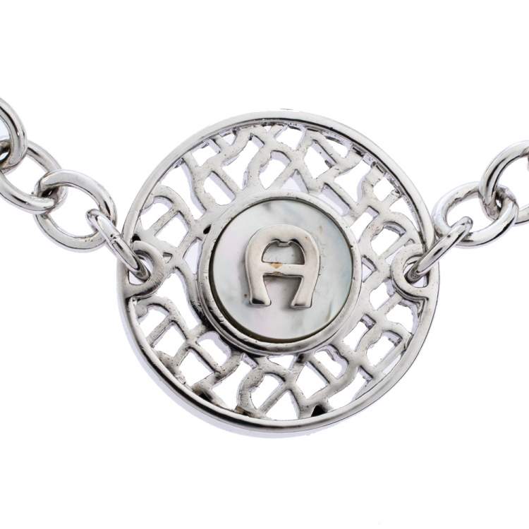 مملوكة مسبقًا Aigner Silver Tone Mother of Pearl Logo Bracelet