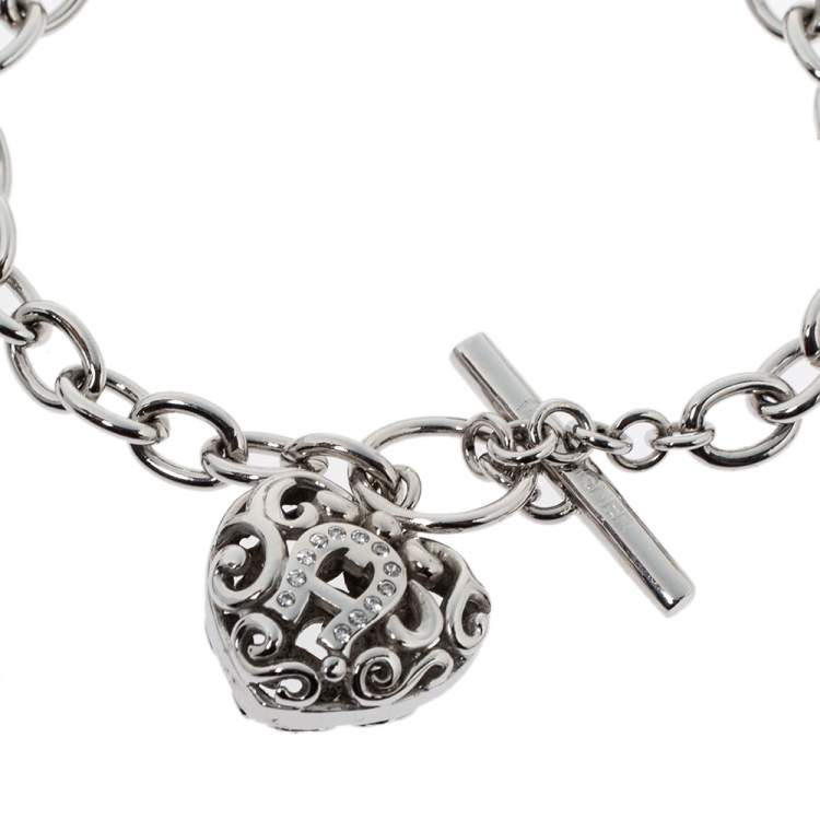 Pre Owned Aigner Silver Tone Crystal Heart Charm Toggle Bracelet