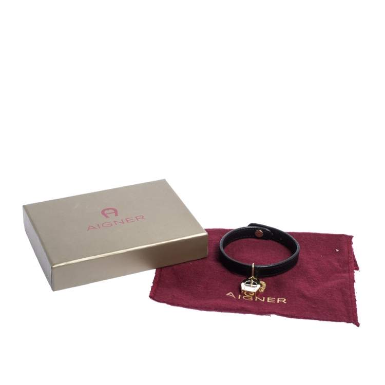 Pre Owned Aigner Black Leather Gold Tone Logo Charm Bracelet
