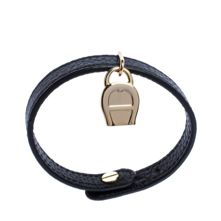 Pre Owned Aigner Black Leather Gold Tone Logo Charm Bracelet