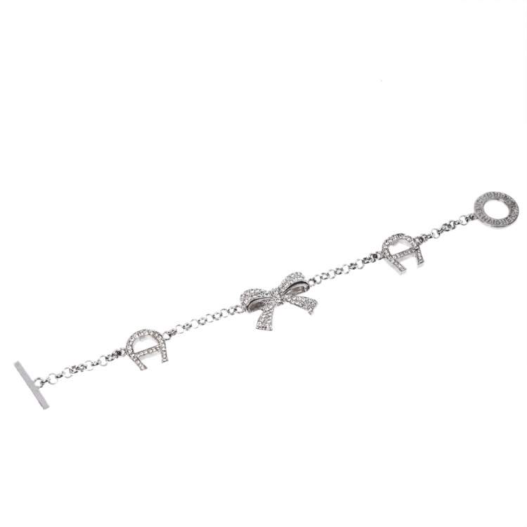 Pre Owned Aigner Silver Tone Crystal Embellished Bow Toggle Bracelet