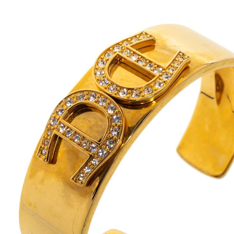 Pre Owned Aigner Crystal Studded Logo Gold Tone open Cuff Bracelet