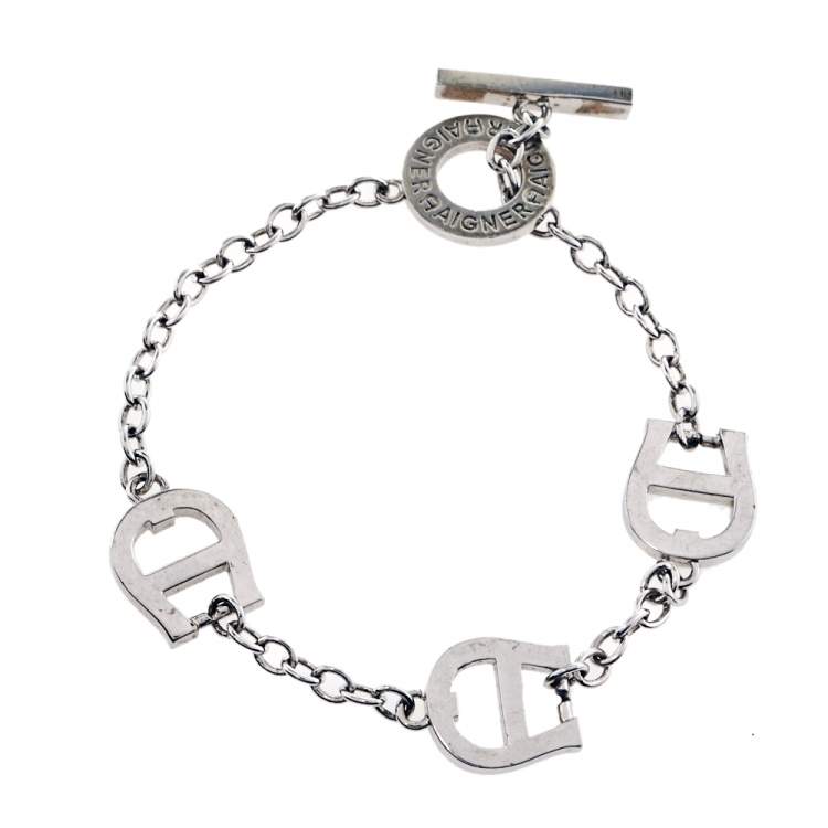 Pre Owned Aigner Silver Tone Crystal and Enamel Logo Toggle Bracelet 