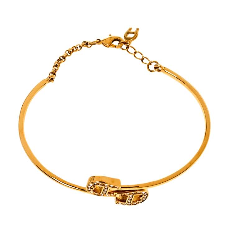 Pre Owned Aigner Crystal Logo Charm Gold Tone Bracelet