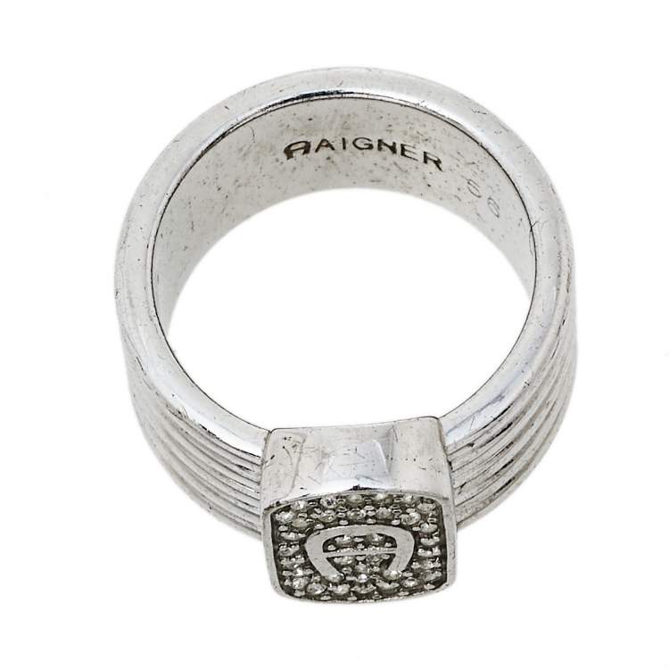 Pre Owned Aigner Silver Tone Crystal Logo Band Ring Size EU 56