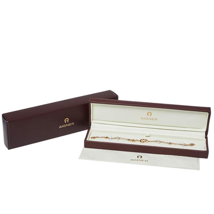 Pre Owned Aigner Rose Gold Tone Crystal Logo Bracelet