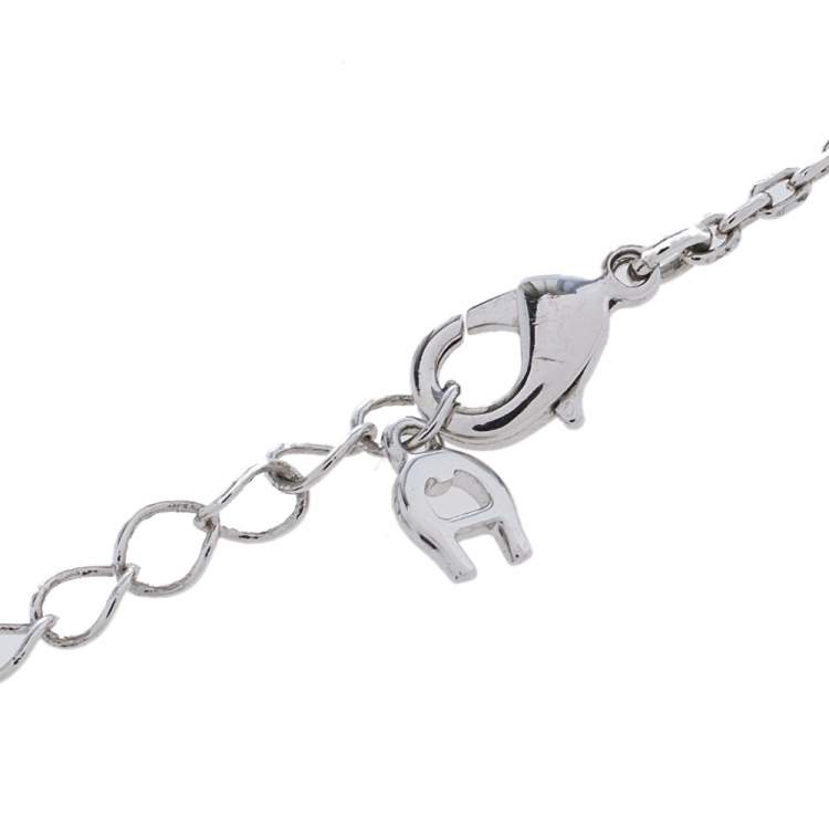 Pre Owned Aigner Silver Tone Crystal Logo Heart Pendant Necklace