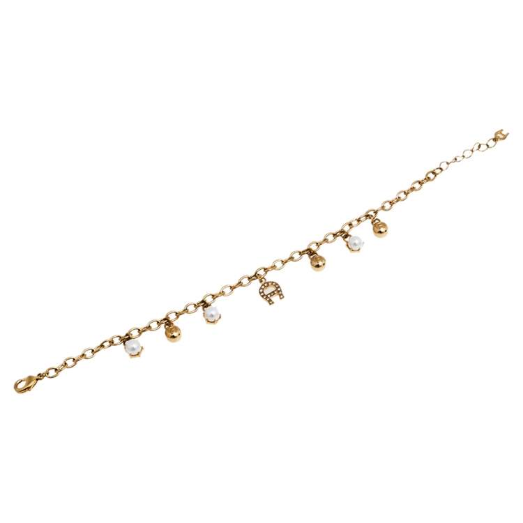 مملوكة مسبقًا Aigner Gold Tone Faux Pearl Charms Bracelet