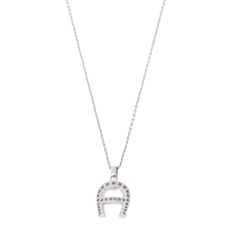 Pre Owned Aigner Silver Tone Crystal Logo Pendant Necklace