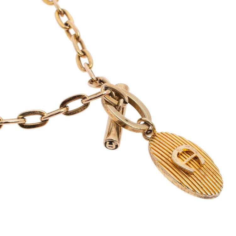 Pre Owned Aigner Gold Tone Logo Pendant Toggle Necklace