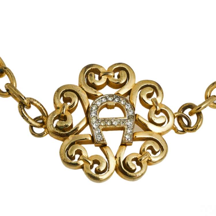 Pre Owned Aigner Gold Tone Crystal Logo Bracelet 