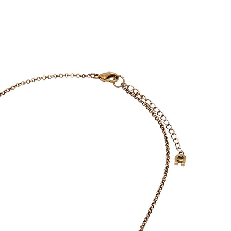 Pre Owned Aigner Mother of Pearl Crystal Gold Tone Metal Necklace