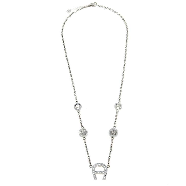 Pre Owned Aigner Silver Tone Crystal Logo Pendant Station Necklace