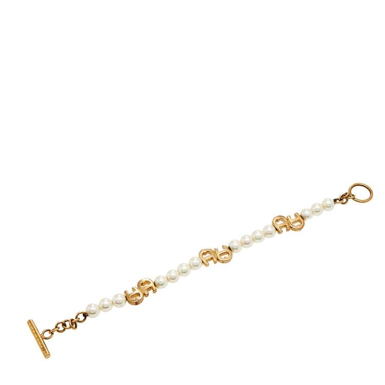 Pre Owned Aigner Gold Tone Faux Pearl Toggle Bracelet