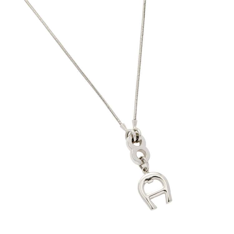 Pre Owned Aigner Logo Silver Tone Metal Pendant Necklace