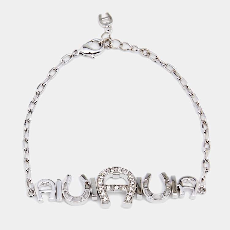 Pre Owned Aigner Silver Tone Crystal Logo & Horseshoe Bracelet