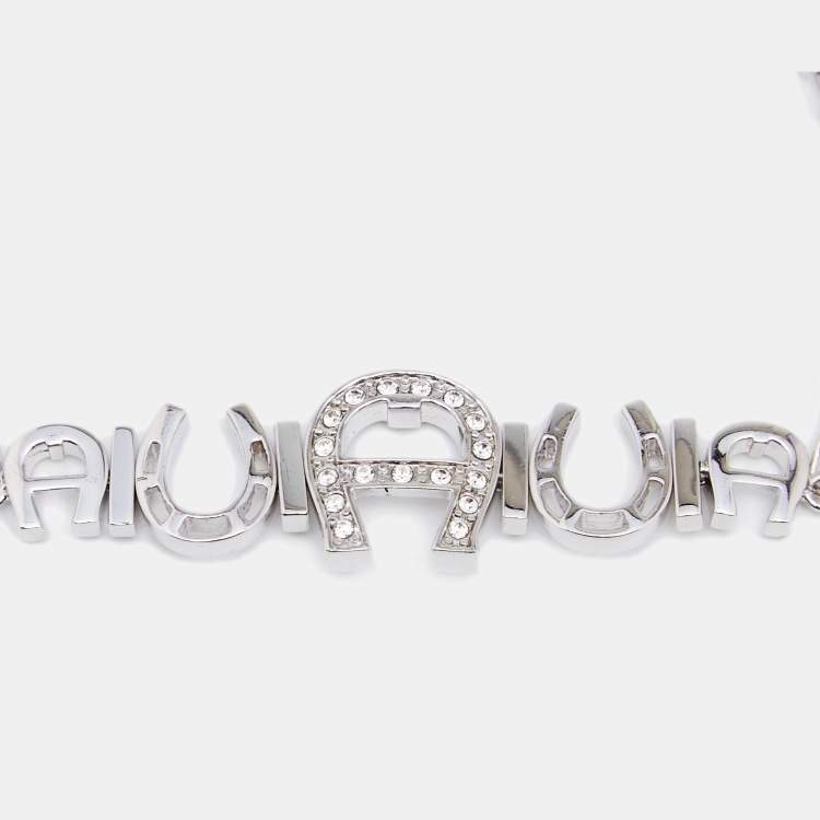Pre Owned Aigner Silver Tone Crystal Logo & Horseshoe Bracelet