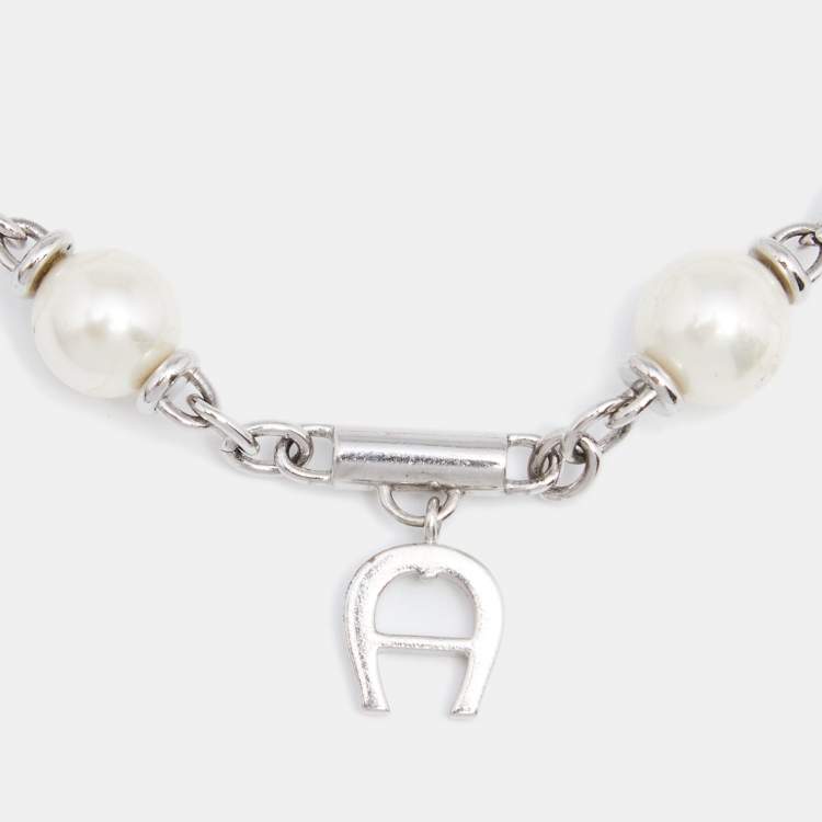 Pre Owned Aigner Silver Tone Logo Charms Pearl Station Bracelet