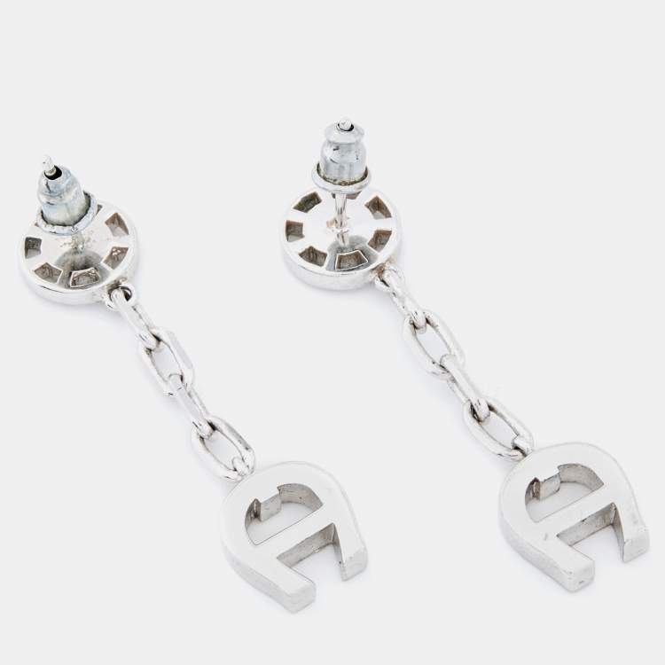 Pre Owned Aigner Silver Tone Crystal Logo Drop Earrings