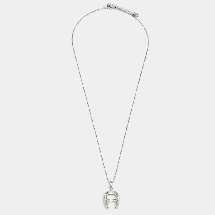 Pre Owned Aigner Silver Tone Crystal Logo Pendant Necklace & Earrings Set