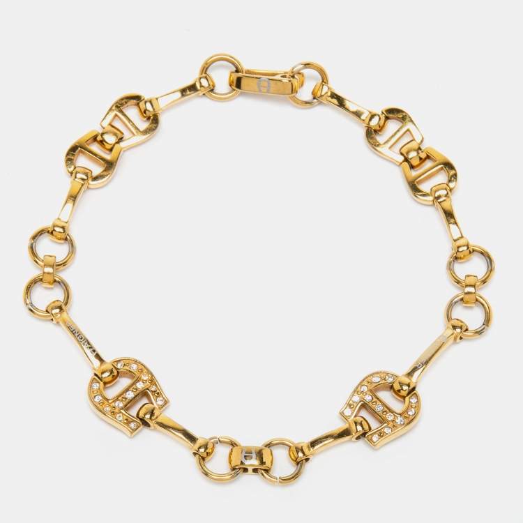 Pre Owned Aigner Gold Tone Crystal Logo Station Bracelet
