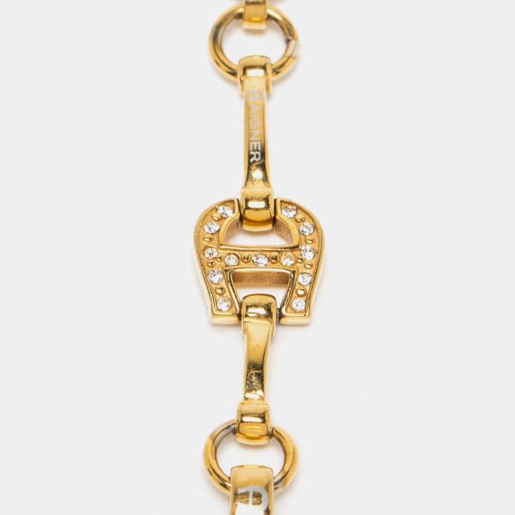 Pre Owned Aigner Gold Tone Crystal Logo Station Bracelet