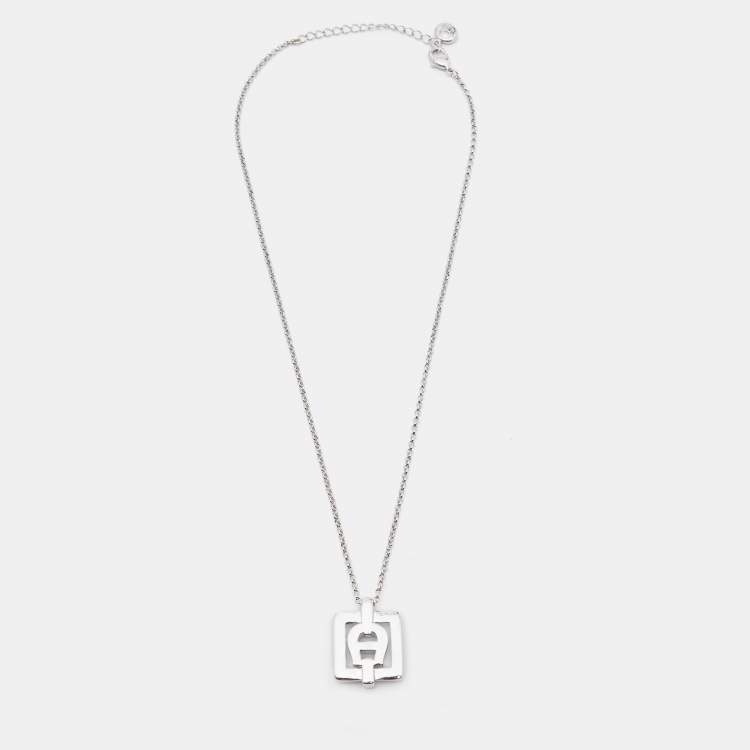 Pre Owned Aigner Silver Tone Square Crystal Logo Pendant Necklace