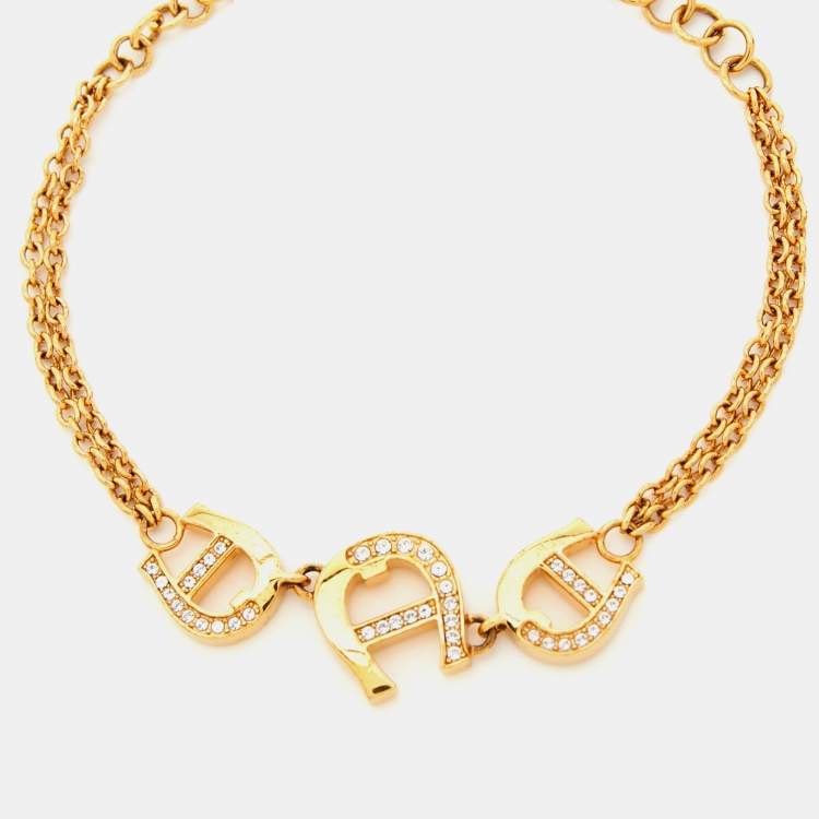 Pre Owned Aigner Gold Tone  Crystal Logo Chain Bracelet