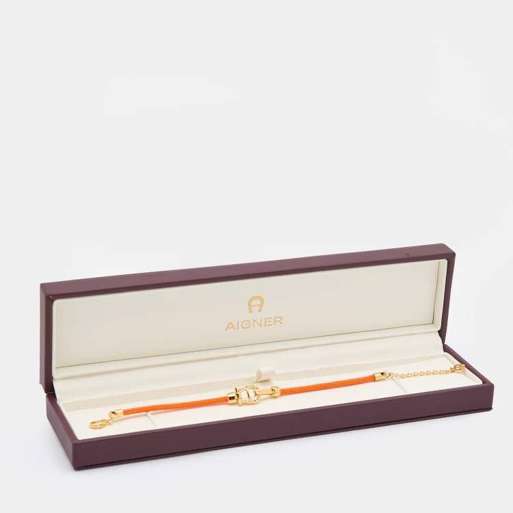 Pre Owned Aigner Orange Silk Cord Crystal Logo Yael Bracelet