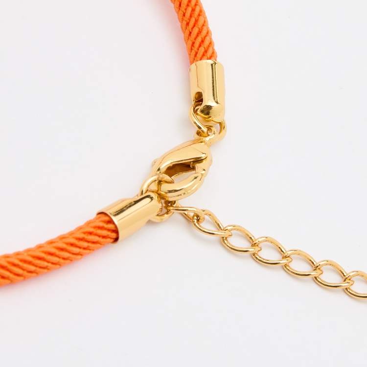 Pre Owned Aigner Orange Silk Cord Crystal Logo Yael Bracelet