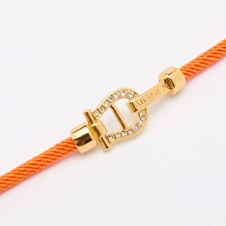 Pre Owned Aigner Orange Silk Cord Crystal Logo Yael Bracelet