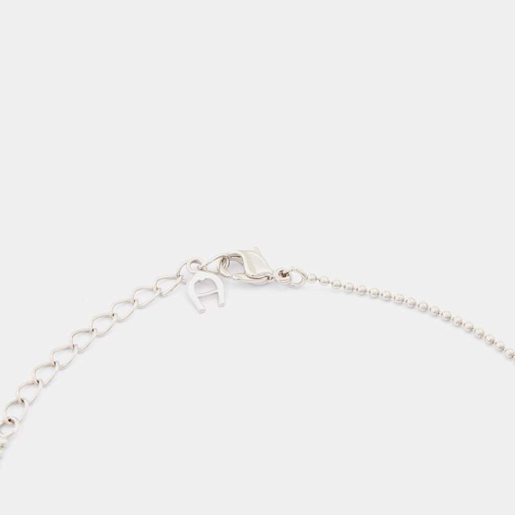 Pre Owned Aigner Silver Tone Crystal Logo Hollow Ball Pendant Necklace