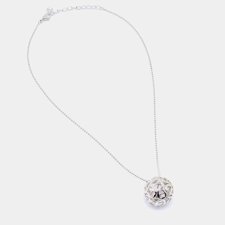 Pre Owned Aigner Silver Tone Crystal Logo Hollow Ball Pendant Necklace