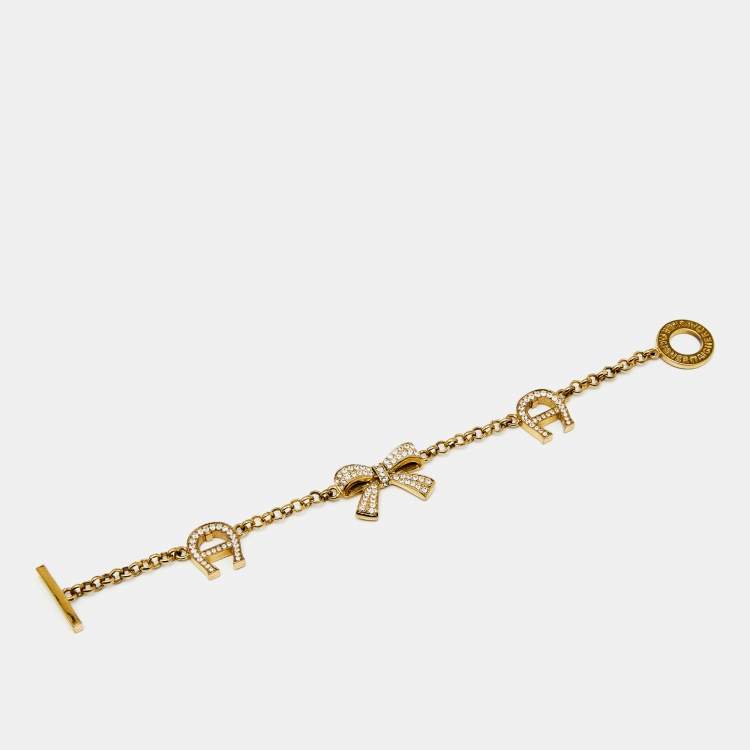 Pre Owned Aigner Bow Crystals Gold Tone Bracelet
