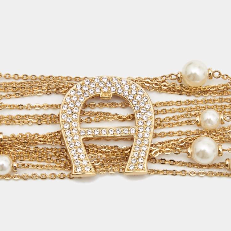 Pre Owned Aigner Capri Faux Pearl & Crystal Logo Gold Tone Bracelet