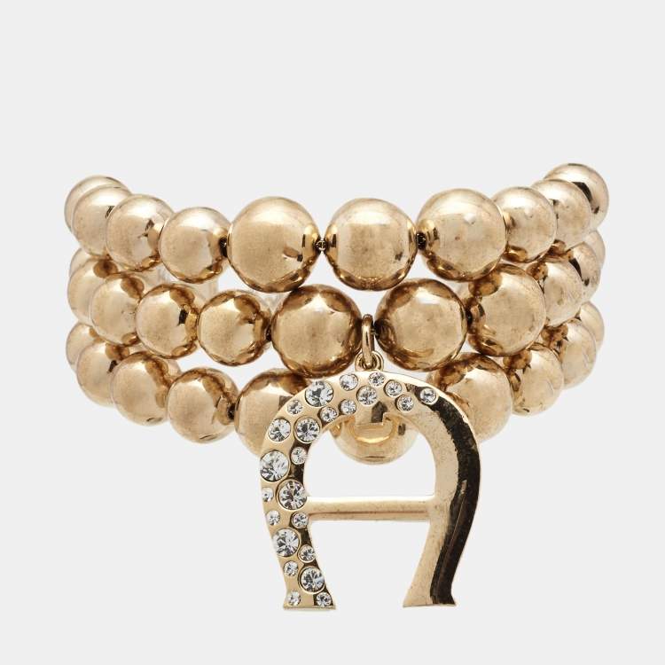 Aigner Bedazzled Gold Plated Crystal Logo Bracelet Aigner | The Luxury ...