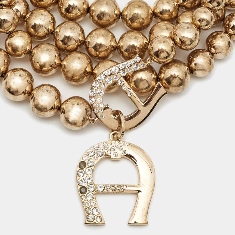 Pre Owned Aigner Bedazzled Crystal Gold Tone Multistrand Necklace
