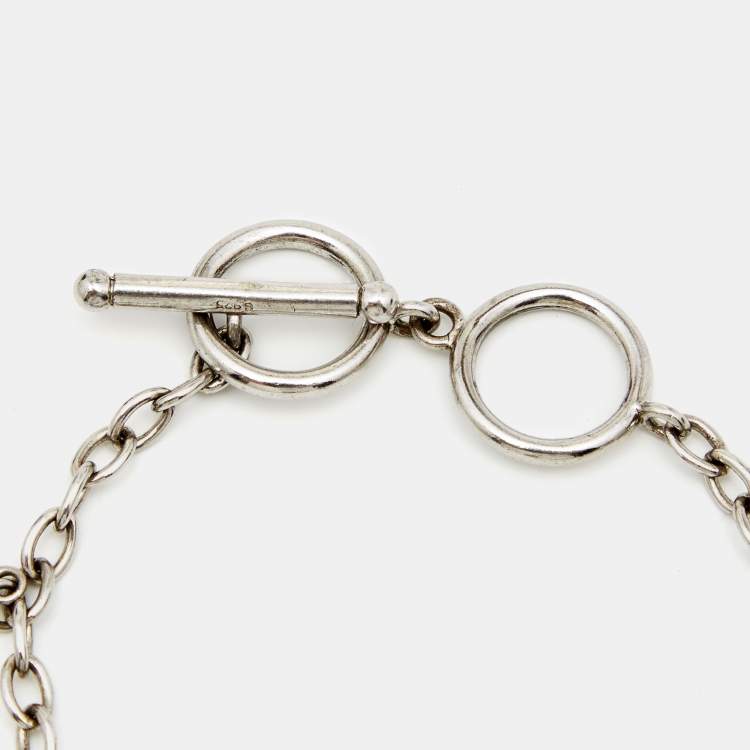 Pre Owned Aigner Sterling Silver Crystal Logo Charm Bracelet