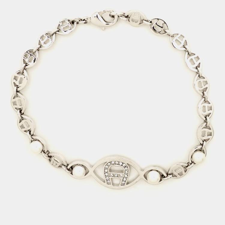 Pre Owned Aigner Logo Crystal Faux Pearl Silver Tone Bracelet
